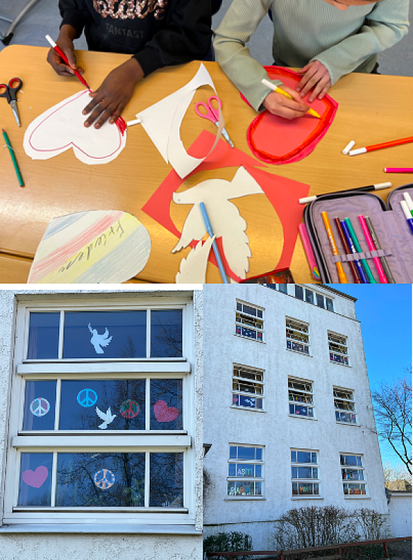 Schüler/ innen basteln Friedenssymbole. 